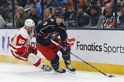 Oct 16, 2023; Columbus, Ohio, USA; Columbus Blue Jackets defenseman Ivan Provorov (9) carries the puck away from Detroit Red Wings right wing Daniel Sprong (88) during the first period at Nationwide Arena. Mandatory Credit: Russell LaBounty-USA TODAY Sports