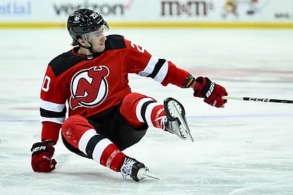 Oct 16, 2023; Newark, New Jersey, USA; New Jersey Devils center Michael McLeod (20) takes a fall against the Florida Panthers during the second period at Prudential Center. Mandatory Credit: John Jones-USA TODAY Sports