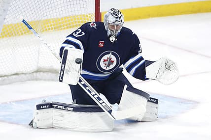 Oct 17, 2023; Winnipeg, Manitoba, CAN; Winnipeg Jets goaltender Connor Hellebuyck (37) warms up before a game against the Los Angeles Kings at Canada Life Centre. Mandatory Credit: James Carey Lauder-USA TODAY Sports
