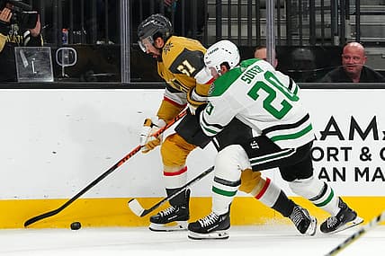 Oct 17, 2023; Las Vegas, Nevada, USA; Vegas Golden Knights right wing Mark Stone (61) skates against Dallas Stars defenseman Ryan Suter (20) during the first period at T-Mobile Arena. Mandatory Credit: Stephen R. Sylvanie-USA TODAY Sports