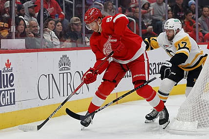 Oct 18, 2023; Detroit, Michigan, USA; Detroit Red Wings defenseman Moritz Seider (53) skates with the puck chased by Pittsburgh Penguins right wing Bryan Rust (17) in the first period at Little Caesars Arena. Mandatory Credit: Rick Osentoski-USA TODAY Sports