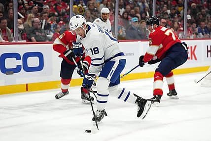 Oct 19, 2023; Sunrise, Florida, USA; Toronto Maple Leafs center Noah Gregor (18) plays the puck against the Florida Panthers during the first period at Amerant Bank Arena. Mandatory Credit: Jasen Vinlove-USA TODAY Sports