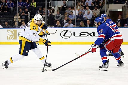 Oct 19, 2023; New York, New York, USA; Nashville Predators left wing Filip Forsberg (9) takes a shot against New York Rangers defensemen Ryan Lindgren (55) and Adam Fox (23) during the second period at Madison Square Garden. Mandatory Credit: Brad Penner-USA TODAY Sports