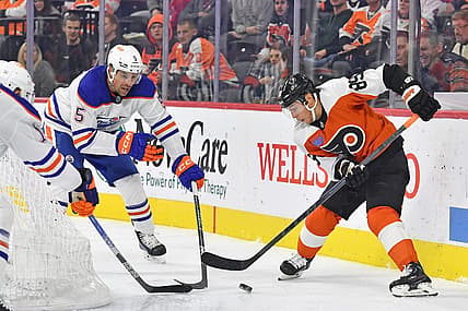 Oct 19, 2023; Philadelphia, Pennsylvania, USA; Philadelphia Flyers right wing Cam Atkinson (89) battle for the puck with Edmonton Oilers defenseman Cody Ceci (5) during the third period at Wells Fargo Center. Mandatory Credit: Eric Hartline-USA TODAY Sports