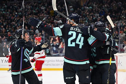 Oct 19, 2023; Seattle, Washington, USA; The Seattle Kraken celebrate after left wing Tye Kartye (52) scored a goal against the Carolina Hurricanes during the third period at Climate Pledge Arena. Mandatory Credit: Steven Bisig-USA TODAY Sports