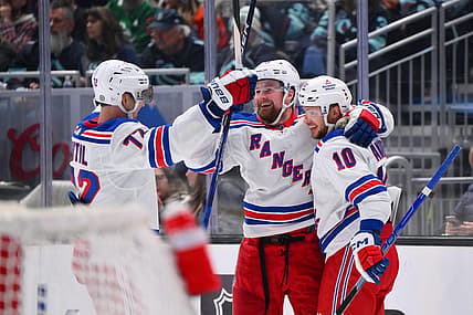 Oct 21, 2023; Seattle, Washington, USA; New York Rangers center Filip Chytil (72) and left wing Alexis Lafreniere (13) and left wing Artemi Panarin (10) celebrate after Panarin scored a goal against the Seattle Kraken during the third period at Climate Pledge Arena. Mandatory Credit: Steven Bisig-USA TODAY Sports