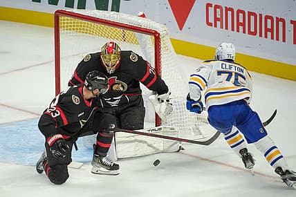 Oct 24, 2023; Ottawa, Ontario, CAN; Ottawa Senators goalie Joonas Korpisalo (70) makes a save on a shot from Buffalo Sabres defenseman Connor Clifton (75) in the third period at the Canadian Tire Centre. Mandatory Credit: Marc DesRosiers-USA TODAY Sports