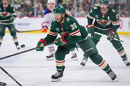 Oct 24, 2023; Saint Paul, Minnesota, USA; Minnesota Wild right wing Ryan Hartman (38) skates after the puck against the Edmonton Oilers in the second period at Xcel Energy Center. Mandatory Credit: Brad Rempel-USA TODAY Sports