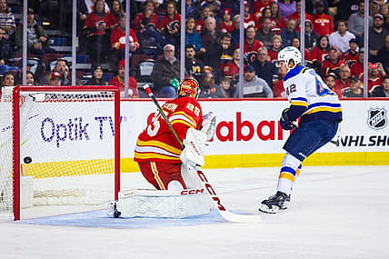 Oct 26, 2023; Calgary, Alberta, CAN; St. Louis Blues right wing Kasperi Kapanen (42) scores a goal against Calgary Flames goaltender Jacob Markstrom (25) during the first period at Scotiabank Saddledome. Mandatory Credit: Sergei Belski-USA TODAY Sports