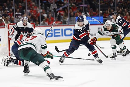 Oct 27, 2023; Washington, District of Columbia, USA; Washington Capitals defenseman Nick Jensen (3) clears the puck from Minnesota Wild center Joel Eriksson Ek (14) in the second period at Capital One Arena. Mandatory Credit: Geoff Burke-USA TODAY Sports