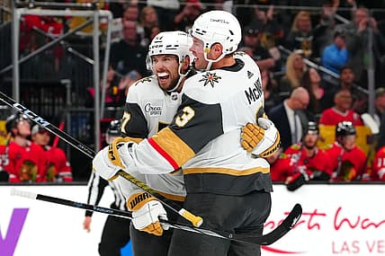 Oct 27, 2023; Las Vegas, Nevada, USA; Vegas Golden Knights defenseman Shea Theodore (27) celebrates with Vegas Golden Knights defenseman Brayden McNabb (3) after scoring a goal against the Chicago Blackhawks during the third period at T-Mobile Arena. Mandatory Credit: Stephen R. Sylvanie-USA TODAY Sports