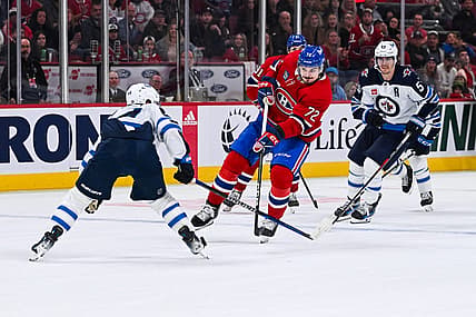 Oct 28, 2023; Montreal, Quebec, CAN; Montreal Canadiens defenseman Arber Xhekaj (72) plays the puck against the Winnipeg Jets during overtime at Bell Centre. Mandatory Credit: David Kirouac-USA TODAY Sports