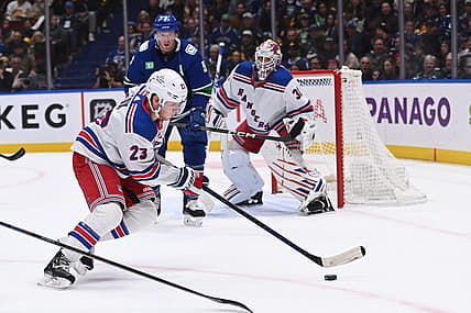 Oct 28, 2023; Vancouver, British Columbia, CAN; New York Rangers defence Adam Fox (23) skates with the puck during first period against the Vancouver Canucks at Rogers Arena. Mandatory Credit: Simon Fearn-USA TODAY Sports