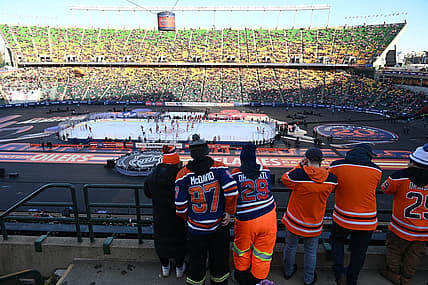 Oct 29, 2023; Edmonton, Alberta, CAN; Fans watch the pre game skate before game action of the Edmonton Oilers as they take on the Calgary Flames in the 2023 Heritage Classic ice hockey game at Commonwealth Stadium. Mandatory Credit: Walter Tychnowicz-USA TODAY Sports