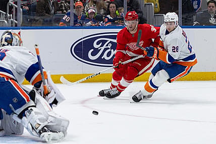Oct 30, 2023; Elmont, New York, USA; Detroit Red Wings right wing Christian Fischer (36) moves towards the puck in front of New York Islanders goaltender Ilya Sorokin (30) during the first period at UBS Arena. Mandatory Credit: Thomas Salus-USA TODAY Sports