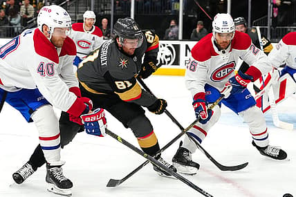 Oct 30, 2023; Las Vegas, Nevada, USA; Vegas Golden Knights right wing Jonathan Marchessault (81) skates between Montreal Canadiens right wing Joel Armia (40) and Montreal Canadiens defenseman Johnathan Kovacevic (26) during the second period at T-Mobile Arena. Mandatory Credit: Stephen R. Sylvanie-USA TODAY Sports