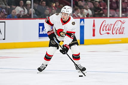 Sep 27, 2023; Montreal, Quebec, CAN; Ottawa Senators defenseman Erik Brannstrom (26) plays the puck against the Montreal Canadiens during the first period at Bell Centre. Mandatory Credit: David Kirouac-USA TODAY Sports