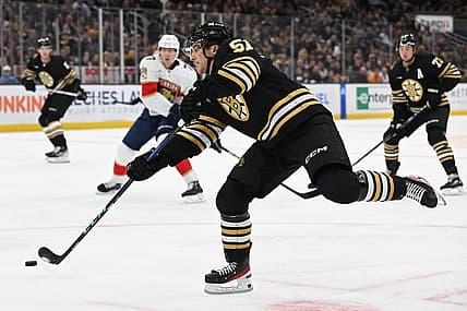 Oct 30, 2023; Boston, Massachusetts, USA; Boston Bruins center Matthew Poitras (51) takes a shot against the Florida Panthers during the first period at the TD Garden. Mandatory Credit: Brian Fluharty-USA TODAY Sports