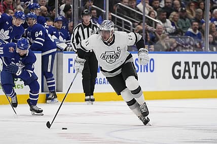 Oct 31, 2023; Toronto, Ontario, CAN; Los Angeles Kings forward Anze Kopitar (11) skates with the puck against the Toronto Maple Leafs during the second period at Scotiabank Arena. Mandatory Credit: John E. Sokolowski-USA TODAY Sports