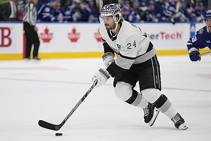 Oct 31, 2023; Toronto, Ontario, CAN; Los Angeles Kings forward Phillip Danault (24) carries the puck against the Toronto Maple Leafs during the third period at Scotiabank Arena. Mandatory Credit: John E. Sokolowski-USA TODAY Sports