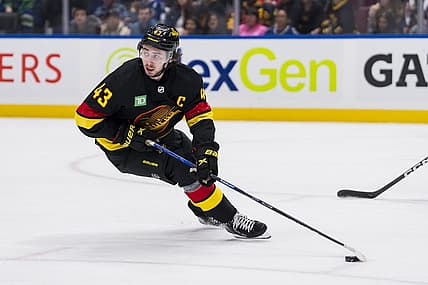 Oct 31, 2023; Vancouver, British Columbia, CAN; Vancouver Canucks defenseman Quinn Hughes (43) handles the puck against the Nashville Predators in the first period at Rogers Arena. Mandatory Credit: Bob Frid-USA TODAY Sports