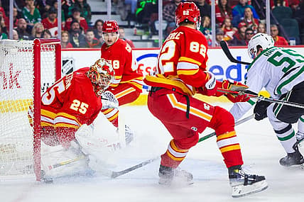 Nov 1, 2023; Calgary, Alberta, CAN; Calgary Flames goaltender Jacob Markstrom (25) makes a save against the Dallas Stars during the first period at Scotiabank Saddledome. Mandatory Credit: Sergei Belski-USA TODAY Sports