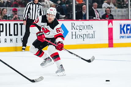 Nov 2, 2023; Saint Paul, Minnesota, USA; New Jersey Devils left wing Jesper Bratt (63) passes during the first period against the Minnesota Wild at Xcel Energy Center. Mandatory Credit: Brace Hemmelgarn-USA TODAY Sports