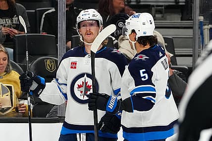 Nov 2, 2023; Las Vegas, Nevada, USA; Winnipeg Jets left wing Kyle Connor (81) celebrates with Winnipeg Jets defenseman Brenden Dillon (5) after scoring a goal against the Vegas Golden Knights during the second period at T-Mobile Arena. Mandatory Credit: Stephen R. Sylvanie-USA TODAY Sports
