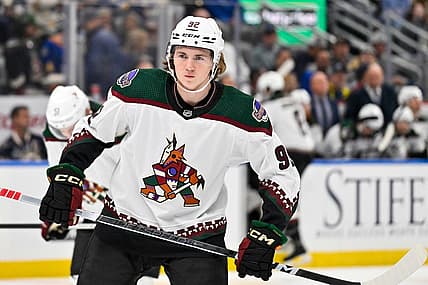Oct 19, 2023; St. Louis, Missouri, USA;  Arizona Coyotes center Logan Cooley (92) waits for a face off against the St. Louis Blues during the first period at Enterprise Center. Mandatory Credit: Jeff Curry-USA TODAY Sports