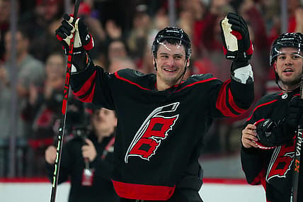 Oct 27, 2023; Raleigh, North Carolina, USA;  Carolina Hurricanes defenseman Dmitry Orlov (7) celebrate their victory against the San Jose Sharks after the game at PNC Arena. Mandatory Credit: James Guillory-USA TODAY Sports