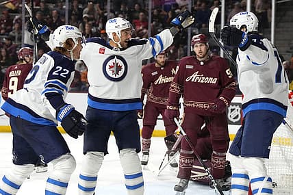 Nov 4, 2023; Tempe, Arizona, USA; Winnipeg Jets right wing Nino Niederreiter (62) celebrates with teammates after scoring a hat trick against the Arizona Coyotes in the third period at Mullett Arena. Mandatory Credit: Rick Scuteri-USA TODAY Sports