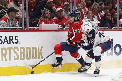 Nov 4, 2023; Washington, District of Columbia, USA; Washington Capitals center Hendrix Lapierre (29) and Columbus Blue Jackets defenseman Damon Severson (78) battle for the puck in the first period at Capital One Arena. Mandatory Credit: Geoff Burke-USA TODAY Sports