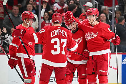 Nov 4, 2023; Detroit, Michigan, USA; Detroit Red Wings defenseman Jake Walman (96) celebrates his goal with center Andrew Copp (18) left wing J.T. Compher (37) and defenseman Moritz Seider (53) during the second period against the Boston Bruins at Little Caesars Arena. Mandatory Credit: Tim Fuller-USA TODAY Sports