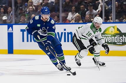 Nov 4, 2023; Vancouver, British Columbia, CAN; Dallas Stars forward Sam Steel (18) watches as Vancouver Canucks forward Elias Pettersson (40) drives up ice in the third period at Rogers Arena. Vancouver won 2-0. Mandatory Credit: Bob Frid-USA TODAY Sports