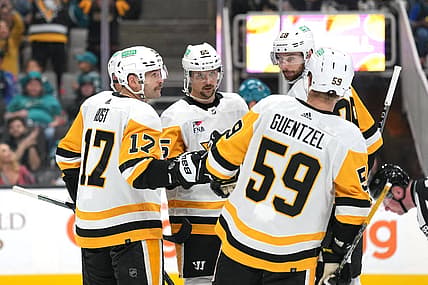 Nov 4, 2023; San Jose, California, USA; Pittsburgh Penguins right wing Bryan Rust (17) celebrates with teammates after scoring a goal against the San Jose Sharks during the third period at SAP Center at San Jose. Mandatory Credit: Darren Yamashita-USA TODAY Sports