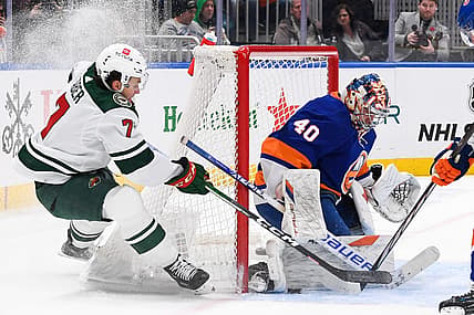 Nov 7, 2023; Elmont, New York, USA; New York Islanders goaltender Semyon Varlamov (40) makes a save against Minnesota Wild defenseman Brock Faber (7) during the first period at UBS Arena. Mandatory Credit: Dennis Schneidler-USA TODAY Sports