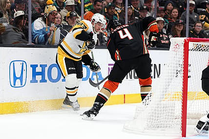 Nov 7, 2023; Anaheim, California, USA; Pittsburgh Penguins center Sidney Crosby (87) and Anaheim Ducks defenseman Cam Fowler (4) fights for the puck during the first period at Honda Center. Mandatory Credit: Kiyoshi Mio-USA TODAY Sports