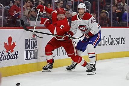 Nov 9, 2023; Detroit, Michigan, USA;  Detroit Red Wings defenseman Olli Maatta (2) and Montreal Canadiens right wing Joel Armia (40) battle for the puck in the first period at Little Caesars Arena. Mandatory Credit: Rick Osentoski-USA TODAY Sports