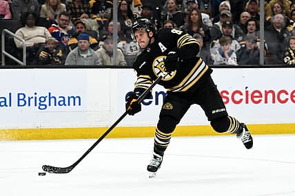 Nov 9, 2023; Boston, Massachusetts, USA; Boston Bruins right wing David Pastrnak (88) takes a shot against the New York Islanders during the third period at the TD Garden. Mandatory Credit: Brian Fluharty-USA TODAY Sports