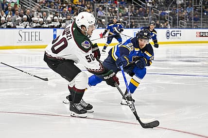 Nov 9, 2023; St. Louis, Missouri, USA;  St. Louis Blues left wing Pavel Buchnevich (89) defends against Arizona Coyotes defenseman Sean Durzi (50) during the second period at Enterprise Center. Mandatory Credit: Jeff Curry-USA TODAY Sports