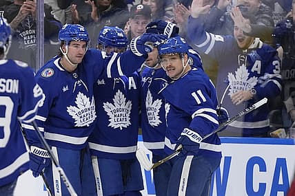 Nov 10, 2023; Toronto, Ontario, CAN; Toronto Maple Leafs defenseman TJ Brodie (78) and forward Max Domi (11) celebrate a goal by forward Calle Jarnkrok (not pictured) against the Calgary Flames during the first period at Scotiabank Arena. Mandatory Credit: John E. Sokolowski-USA TODAY Sports