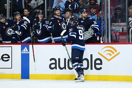 Nov 11, 2023; Winnipeg, Manitoba, CAN;  Winnipeg Jets forward Cole Perfetti (91) is congratulated by his teammates on his goal against the Dallas Stars during the second period at Canada Life Centre. Mandatory Credit: Terrence Lee-USA TODAY Sports