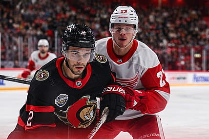 Nov 16, 2023; Stockholm, SWE; Ottawa Senators defenseman Artem Zub (2) and Detroit Red Wings left wing Lucas Raymond (23) battle for position during a Global Series NHL hockey game at Avicii Arena. Mandatory Credit: Per Haljestam-USA TODAY Sports