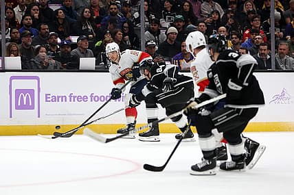 Nov 16, 2023; Los Angeles, California, USA; Florida Panthers center Sam Reinhart (13) passes the puck during the first period against the Los Angeles Kings at Crypto.com Arena. Mandatory Credit: Kiyoshi Mio-USA TODAY Sports