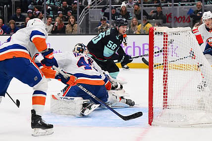 Nov 16, 2023; Seattle, Washington, USA; Seattle Kraken right wing Kailer Yamamoto (56) scores a goal past New York Islanders goaltender Semyon Varlamov (40) during the third period at Climate Pledge Arena. Mandatory Credit: Steven Bisig-USA TODAY Sports