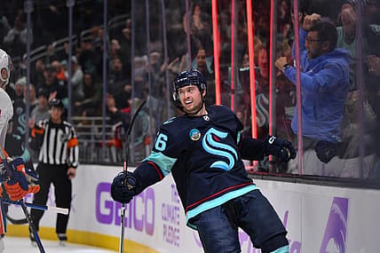 Nov 16, 2023; Seattle, Washington, USA; Seattle Kraken right wing Kailer Yamamoto (56) celebrates after scoring a goal against the New York Islanders during the third period at Climate Pledge Arena. Mandatory Credit: Steven Bisig-USA TODAY Sports