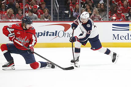 Nov 18, 2023; Washington, District of Columbia, USA; Columbus Blue Jackets left wing Johnny Gaudreau (13) shoots the puck as Washington Capitals defenseman Rasmus Sandin (38) defends during the second period at Capital One Arena. Mandatory Credit: Amber Searls-USA TODAY Sports