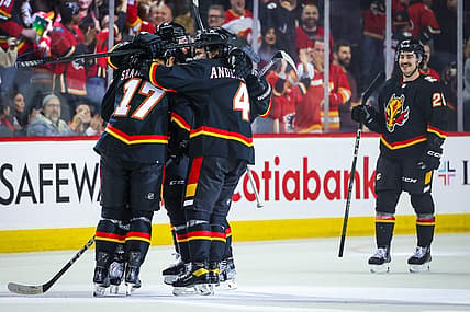 Nov 18, 2023; Calgary, Alberta, CAN; Calgary Flames center Yegor Sharangovich (17) celebrates his goal with teammates against the New York Islanders during the third period at Scotiabank Saddledome. Mandatory Credit: Sergei Belski-USA TODAY Sports