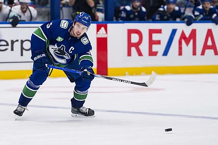 Nov 18, 2023; Vancouver, British Columbia, CAN; Vancouver Canucks defenseman Quinn Hughes (43) makes a pass against the Seattle Kraken in the third period at Rogers Arena. Seattle won 4-3. Mandatory Credit: Bob Frid-USA TODAY Sports