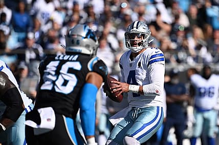Nov 19, 2023; Charlotte, North Carolina, USA;  Dallas Cowboys quarterback Dak Prescott (4) looks to pass as Carolina Panthers linebacker Eku Leota (46) defends in the second quarter at Bank of America Stadium. Mandatory Credit: Bob Donnan-USA TODAY Sports